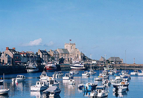 Barfleur Harbor with lighthouse.  Copyright Cold Spring Press.  All rights reserved.