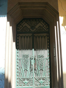 Door with wrought iron fountain motif