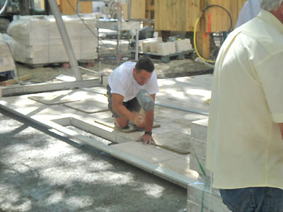 Workman setting pavers.  Copyright 2012 Marlane O'Neill.  All rights reserved.