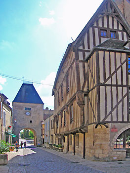 Medieval gate and timberframe houses Noyers.  Copyright Cold Spring Press. All rights reserved.